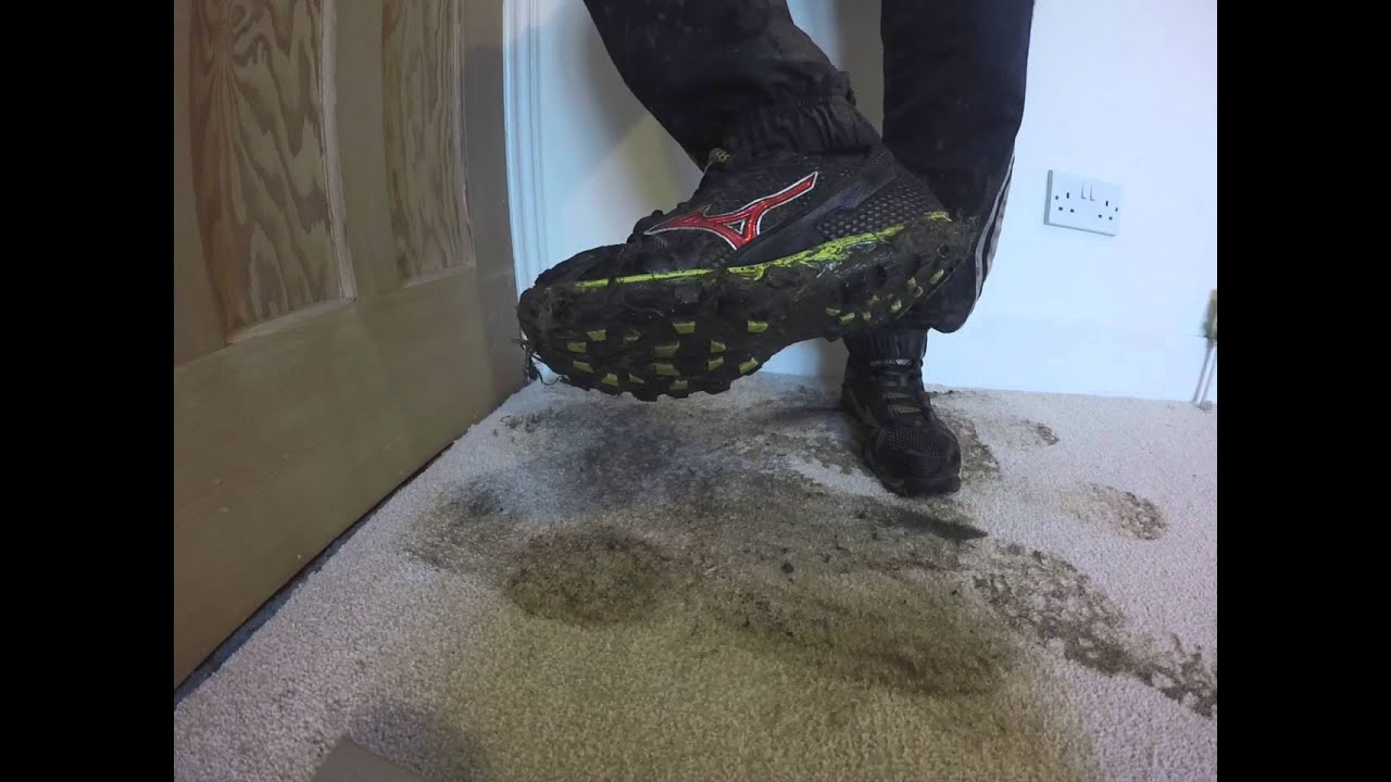 Muddy Mizuno trainers leave footprints on carpet