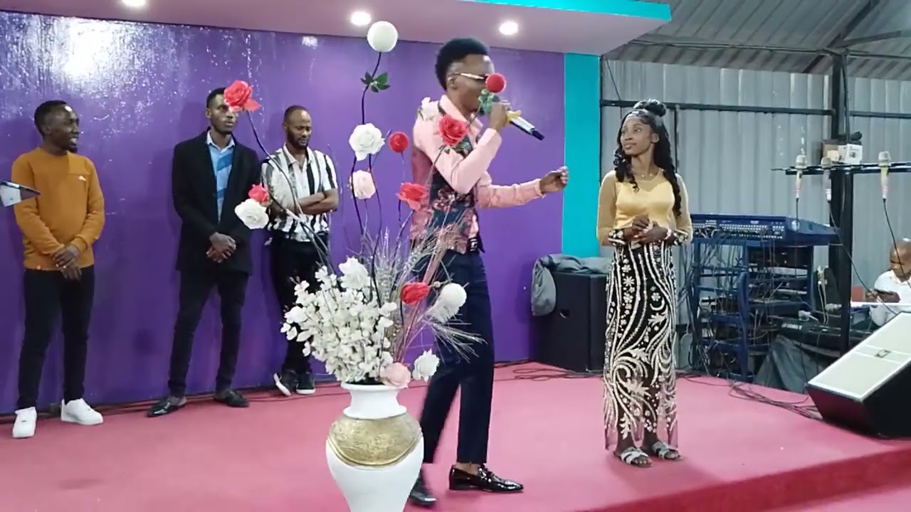 STEPHEN KASOLO GIVES LIZ MUSASI 20K DURING LIZ MUSASI LAUNCH 