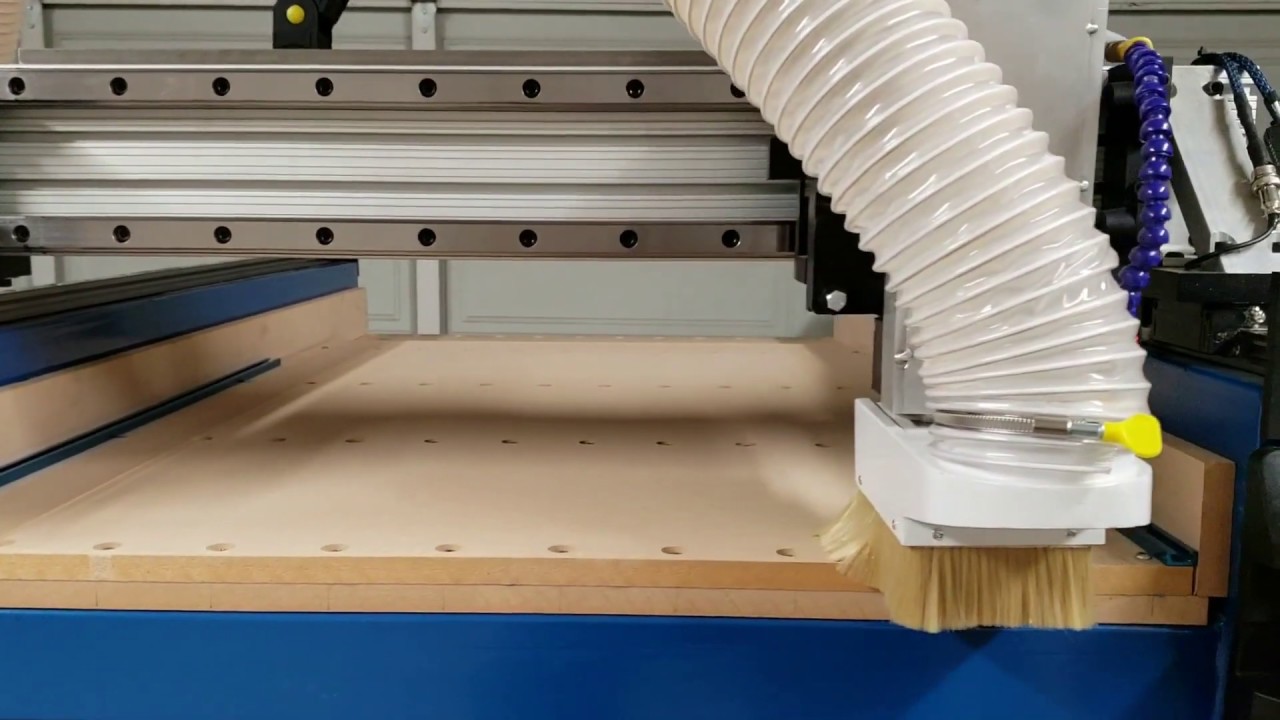 CNC router equipped with Centroid Acorn controller, spoil board surface with Vcarve Pro