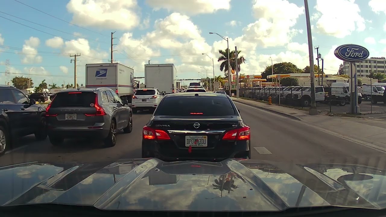 Driving in Miami on NW 72nd Avenue. Wednesday afternoon with some traffic.