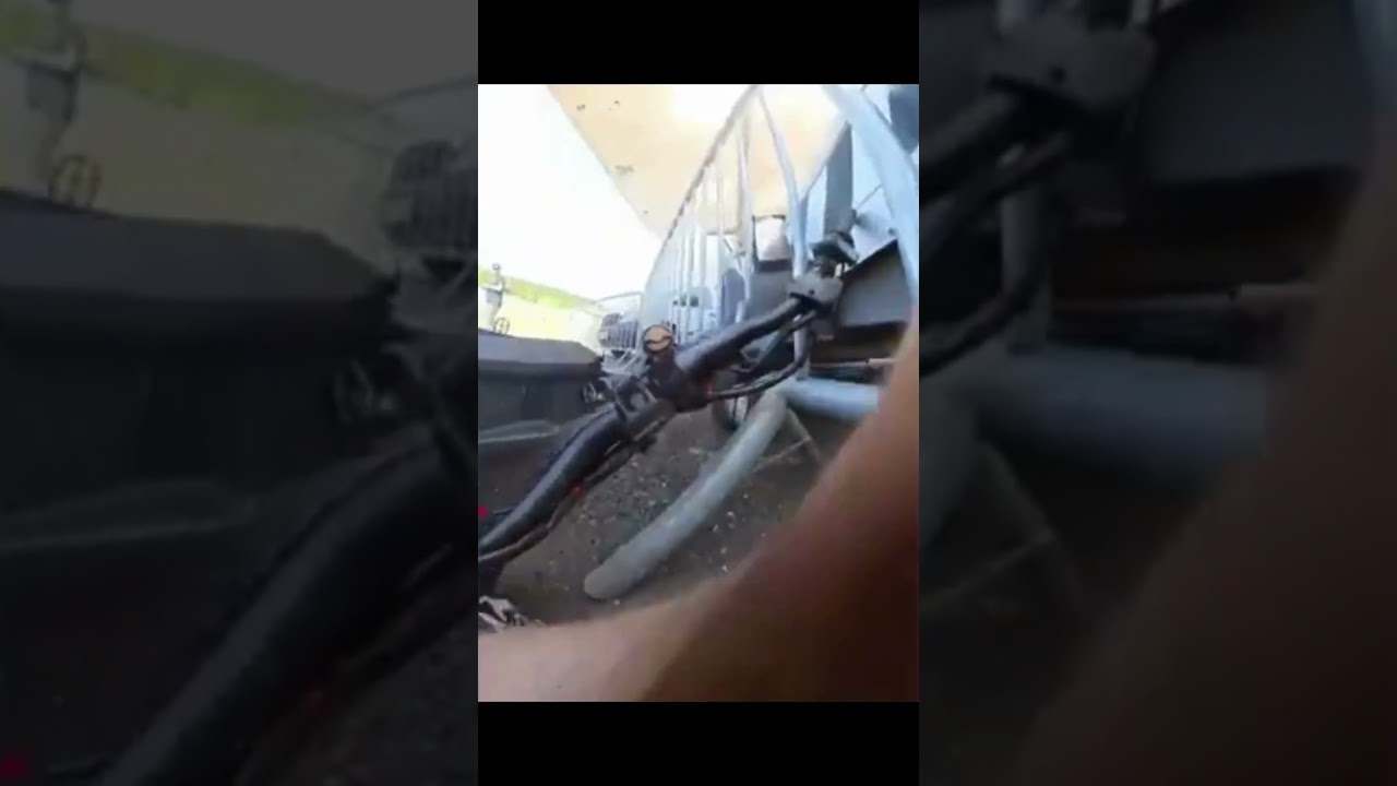 Epic Motorcycle Fail: Rider Slams Into Railing in Unexpected Twist!