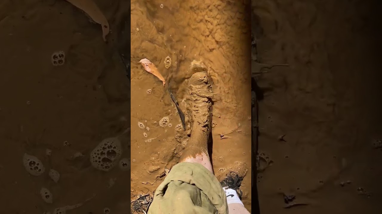Black converse and white socks get muddy