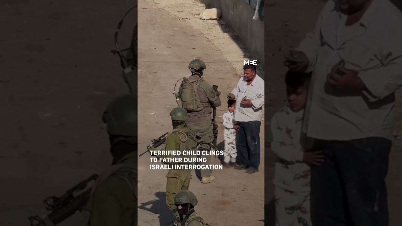 Palestinian child clings to father in fear of Israeli soldiers