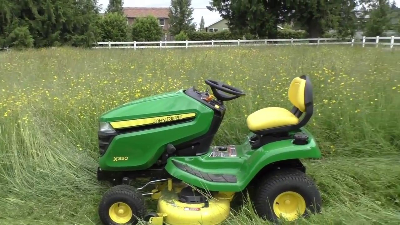 John Deere X350 mowing grass 4-5 feet tall, yes it can do it!