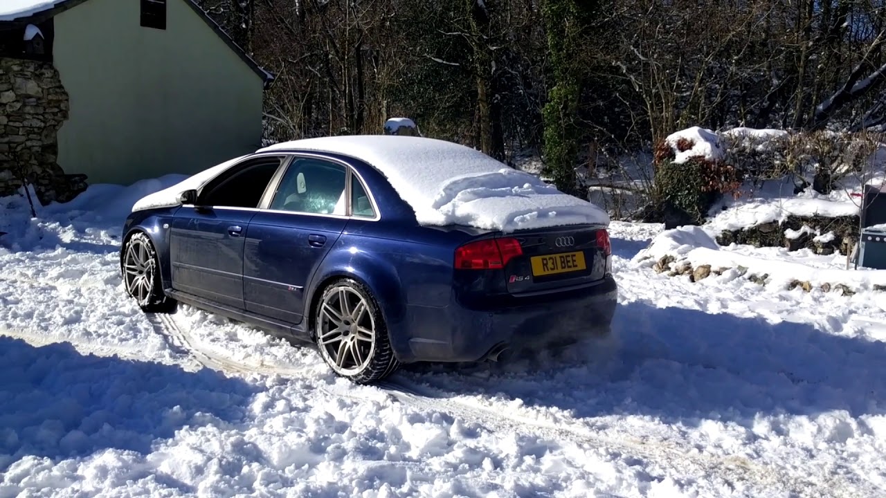 Audi RS4 B7 in the snow. Stock exhaust.