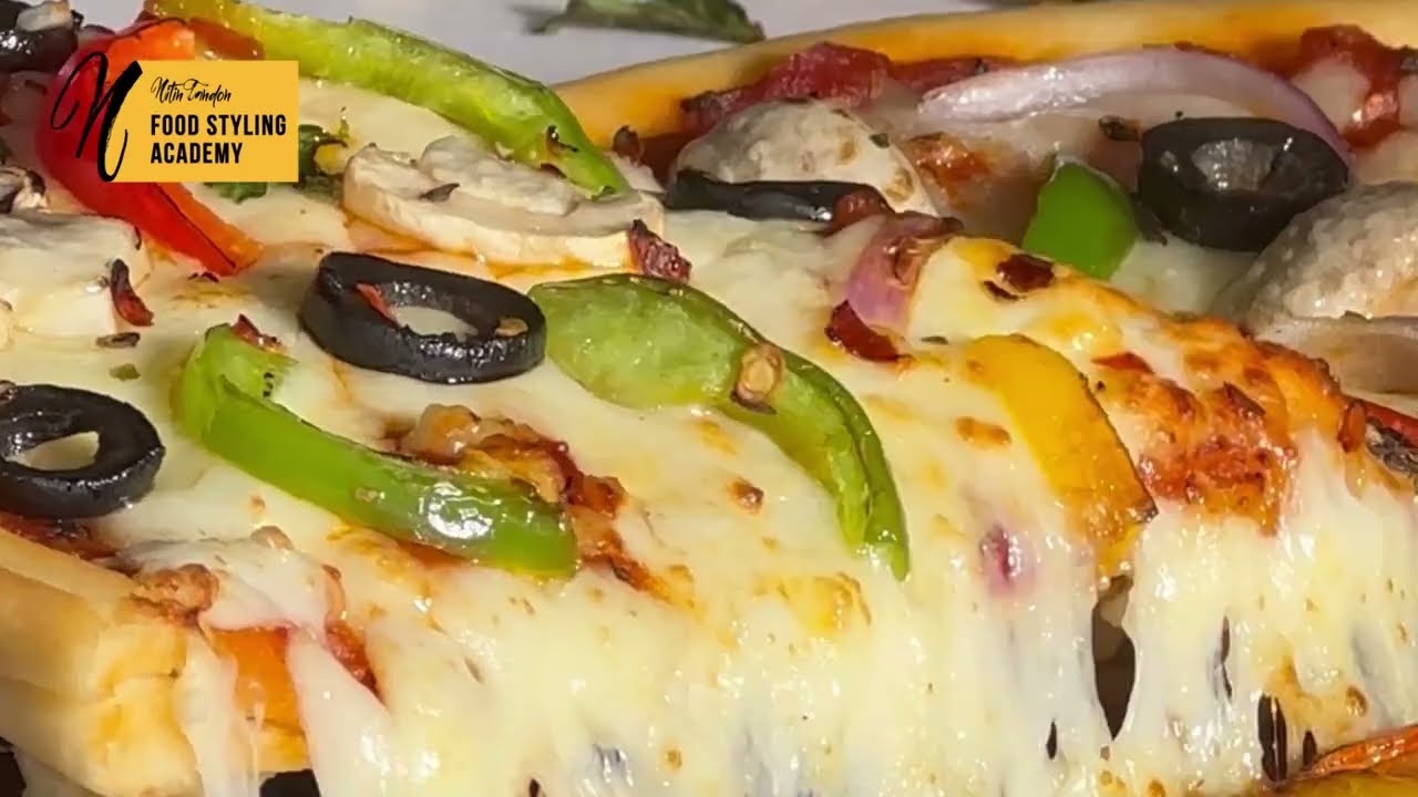 Learn to get the perfect Pizza cheese pull stretch with our tips on food styling and photography.