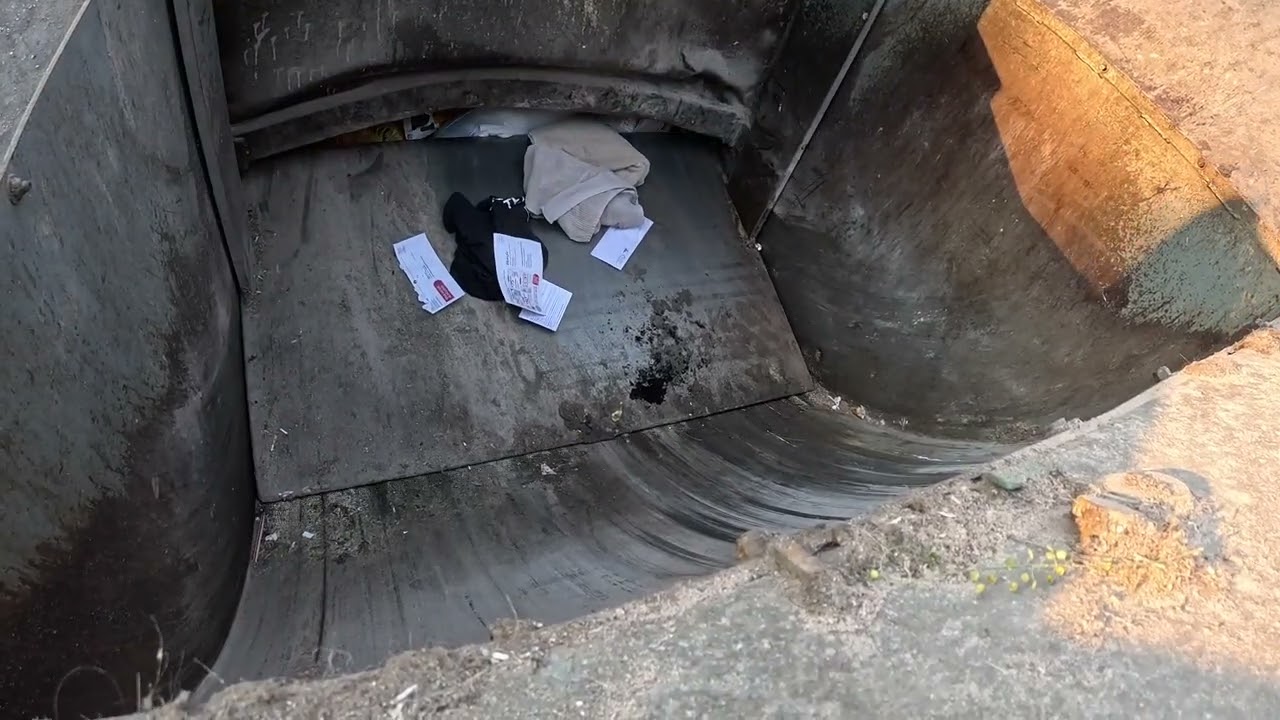 Garbage truck hopper POV: Autocar Pendpac dumping trash