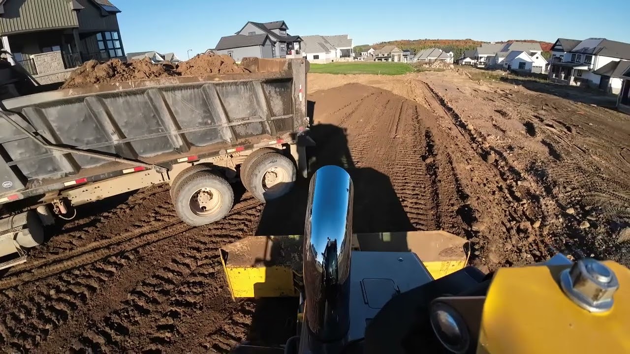 John Deere 650p grading topsoil
