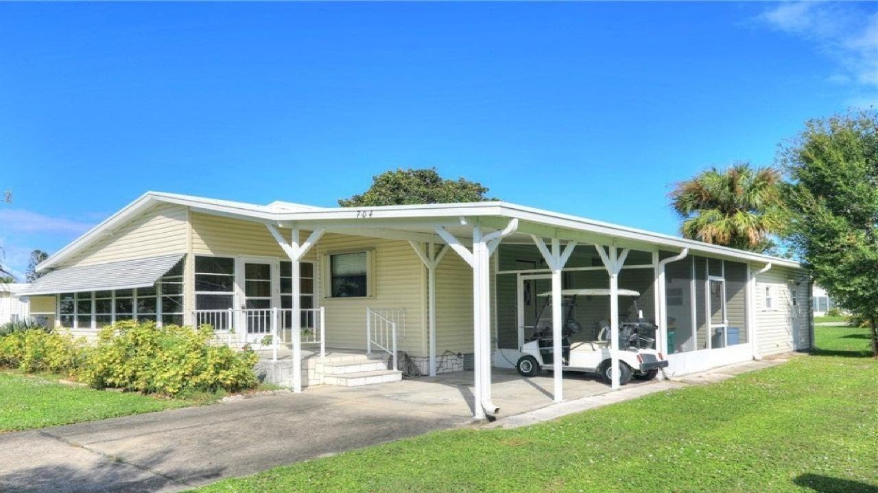 704 Barefoot Boulevard, Barefoot Bay, FL Presented by Robin Burgarella.