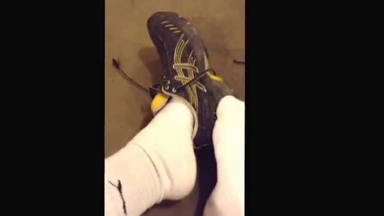Taking off Black and Yellow Asics.  Sneaker fetish