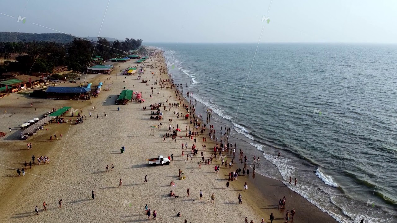 Arambol Goa India Freak Parade Carnival at the sunset beach drone fly over