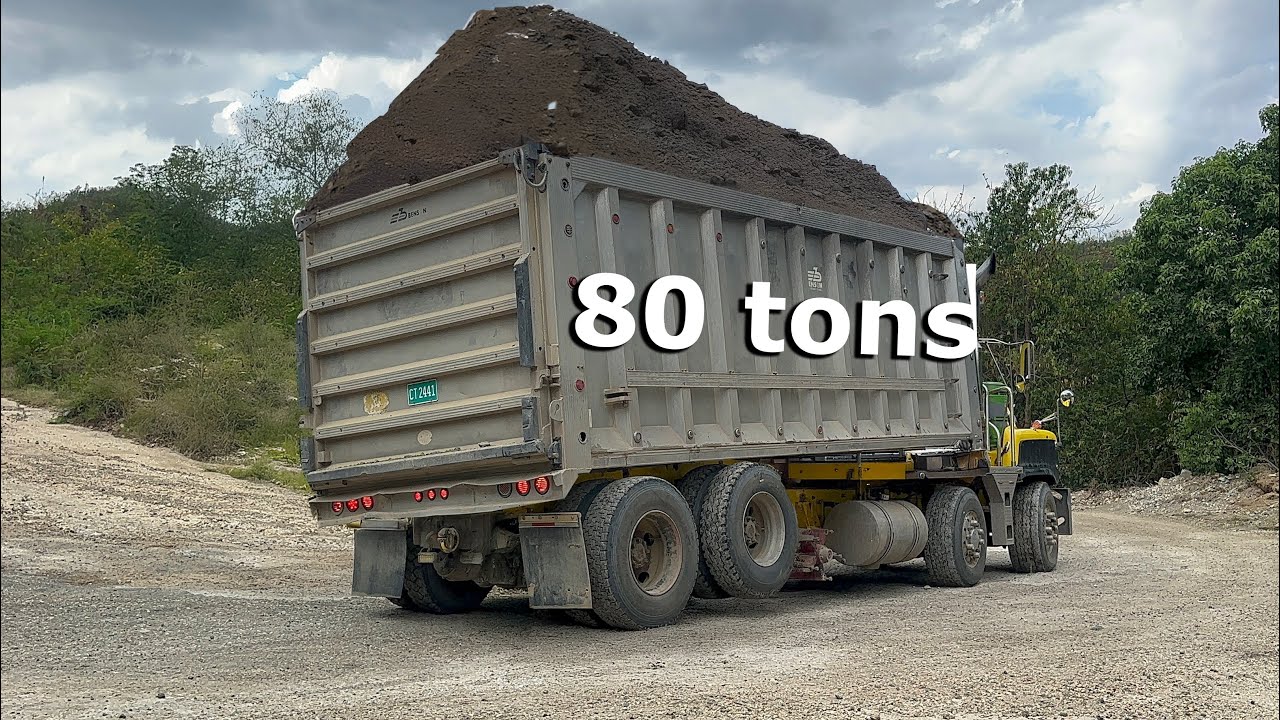 Heavily loaded trucks navigate a steep corner | Shale Mining | S4, E9