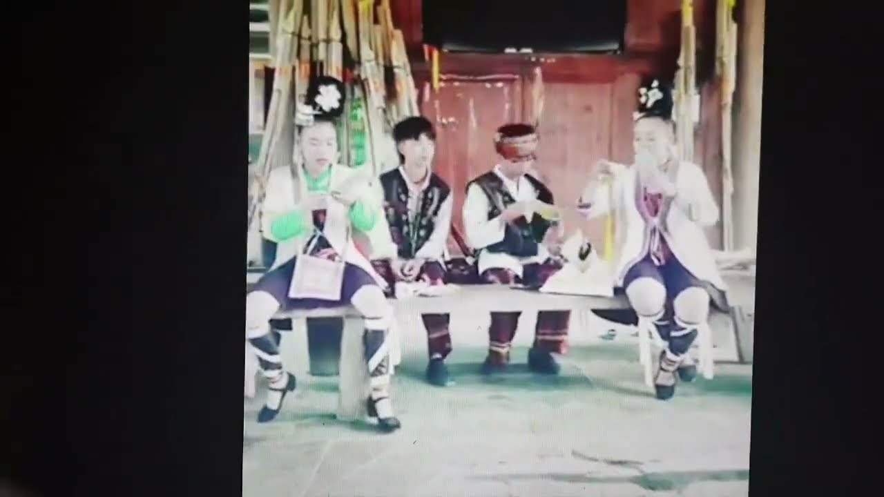 Dong Nationality Boys and Girls Singing in a Drum Tower in Zhaoxing, Guizhou Province, China. 2019.