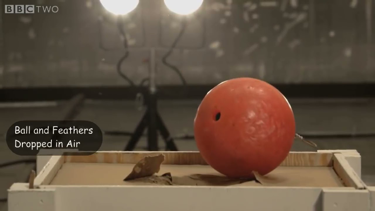 01 Bowling Ball and Feathers Dropped in Air and then Vacuum