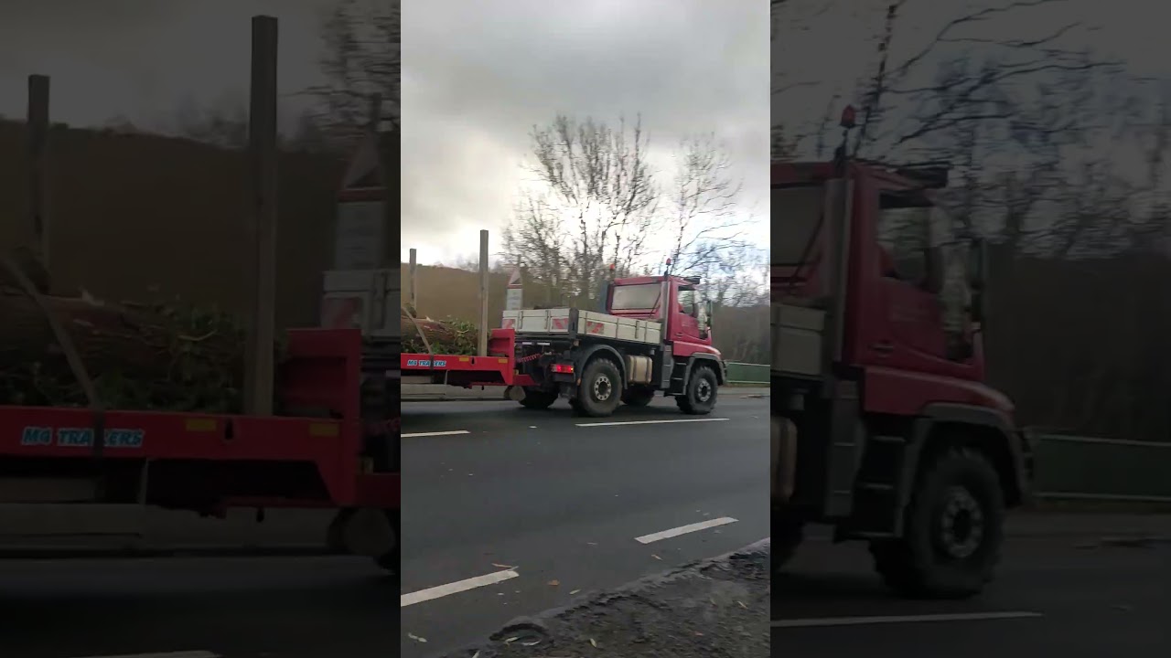 Unimog pulling a digger around wales