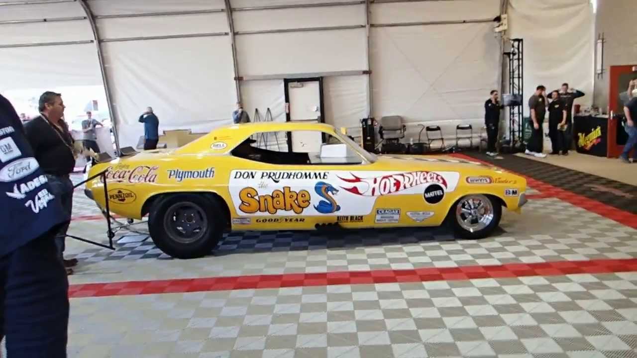 The Snake driving his funny car for the last time.