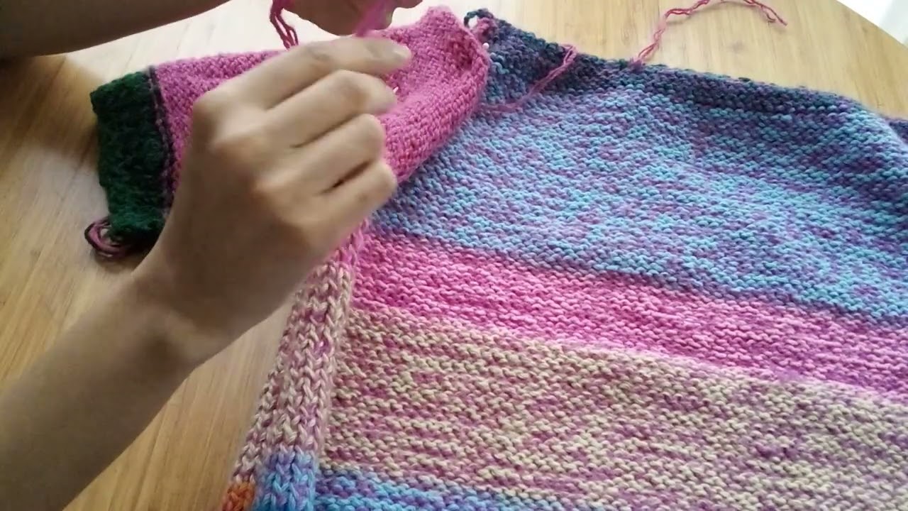 Aprendiendo a colocar la manga de un sweater tejido a dos agujas