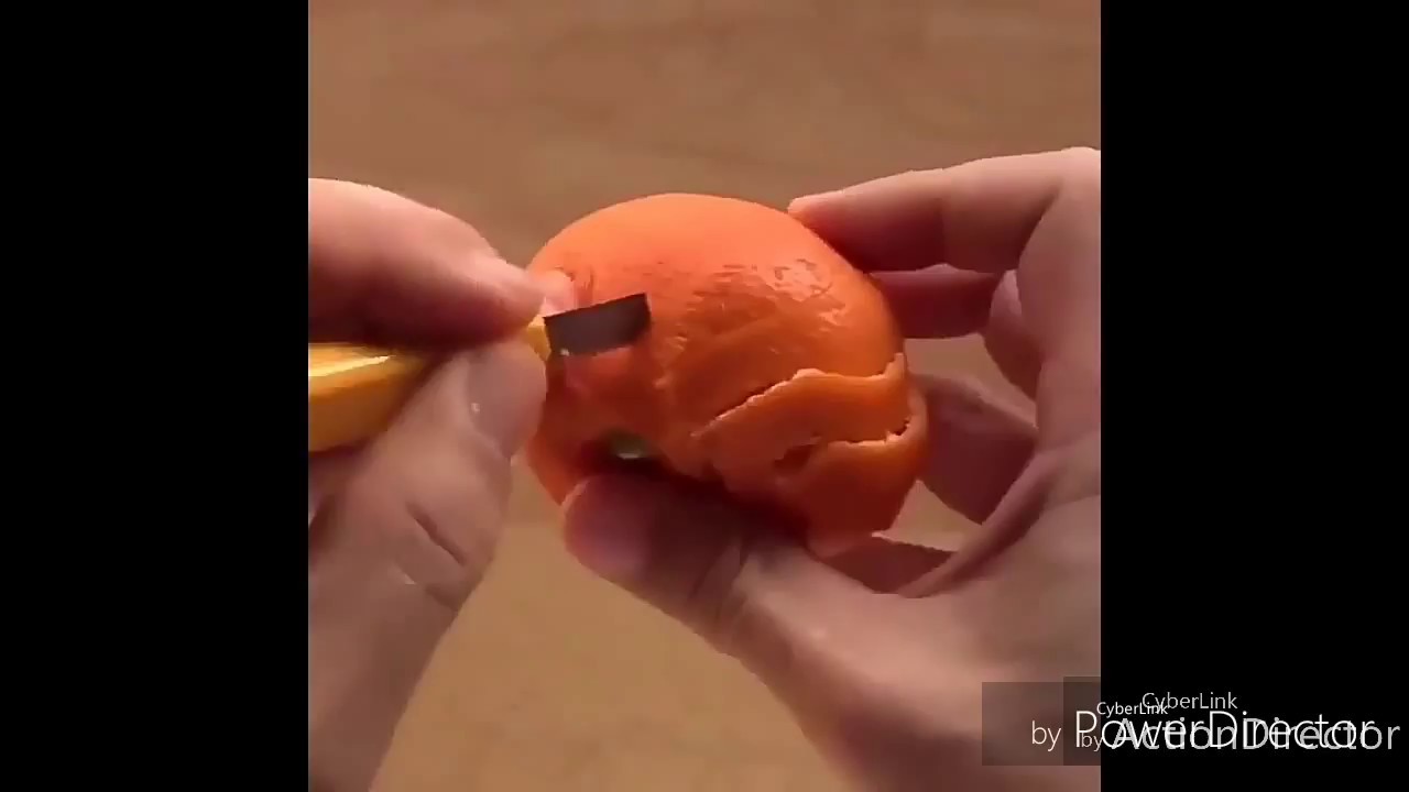 Carving a horse on Mandarin skin