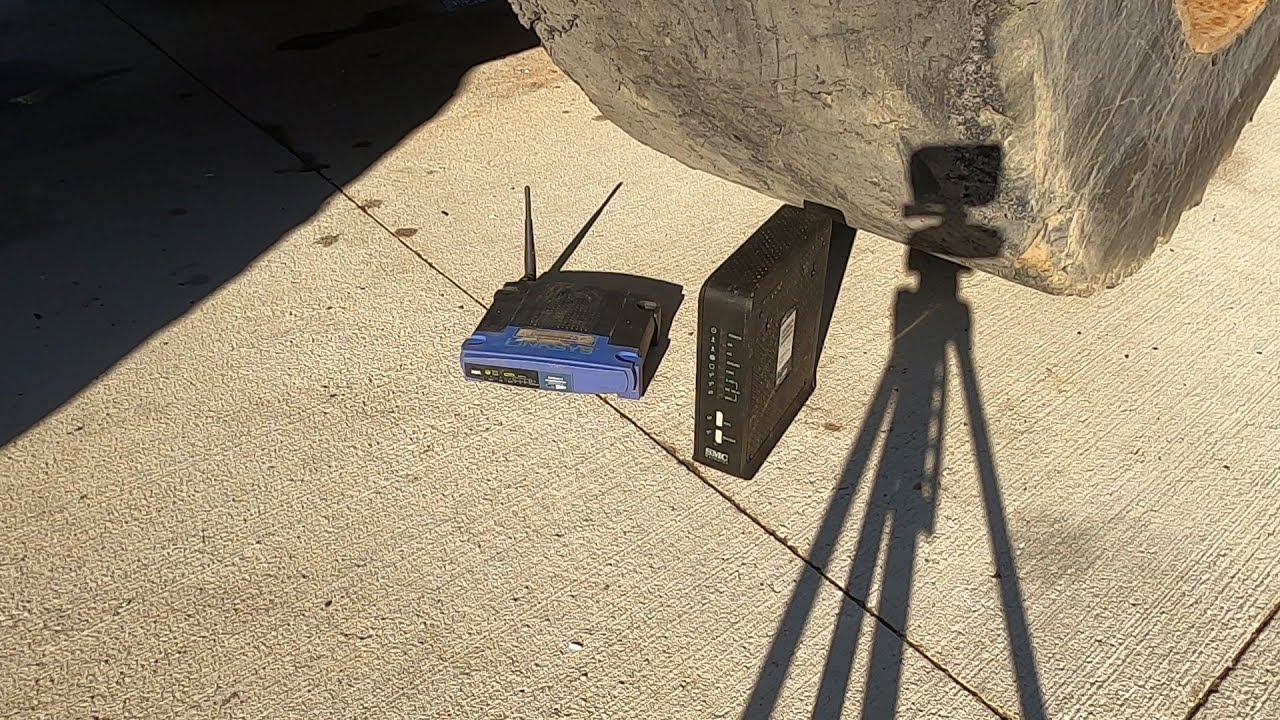 Crushing a modem and router (1x and 1/8th speed slow motion)