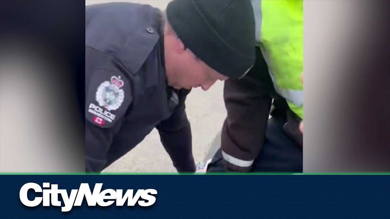 Questions over video of Edmonton police arrest showing knee near driver's neck