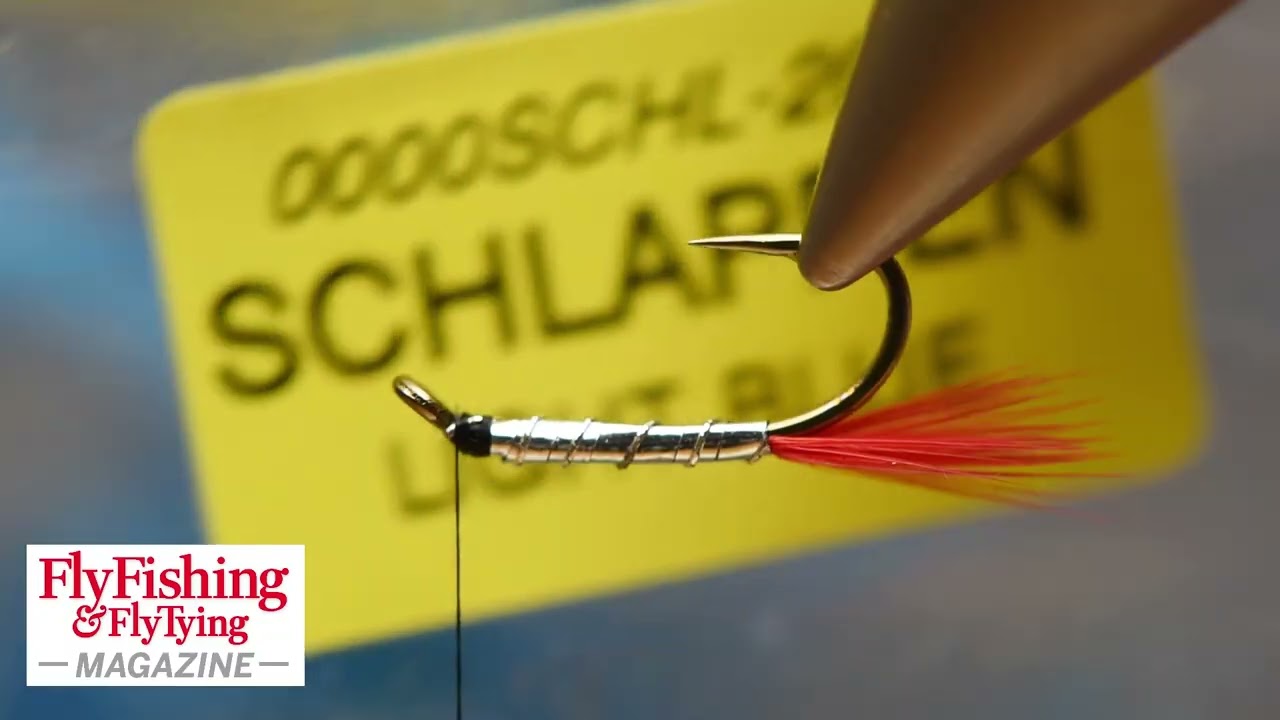 Magnus Angus ties a Teal, Blue & Silver with a red tail