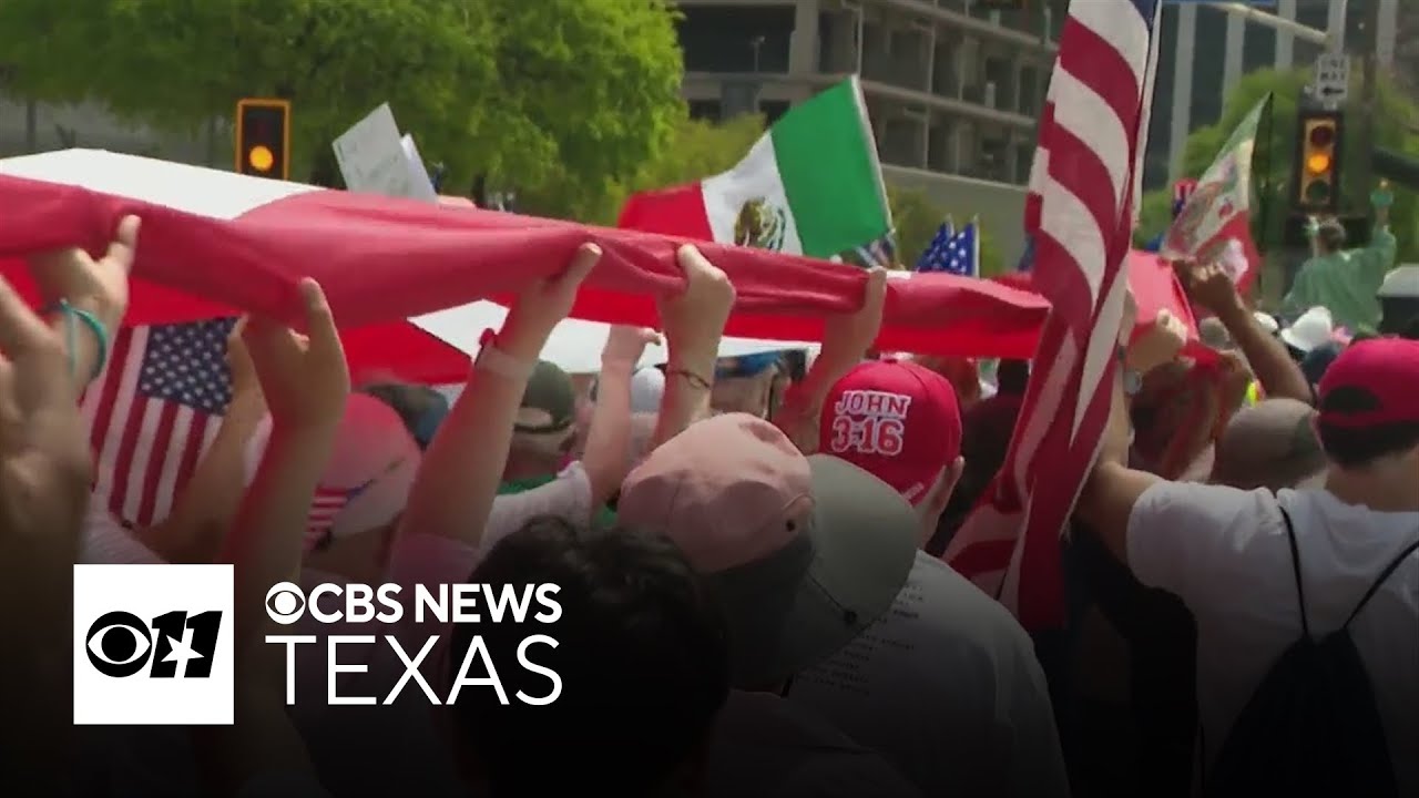 Demonstrators march through downtown Dallas for the Mega March 2025