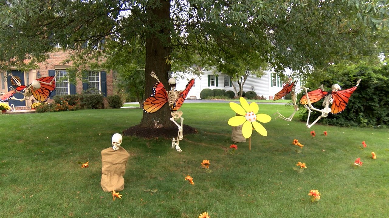 Homeowners create stories on their yards with skeletons for Halloween