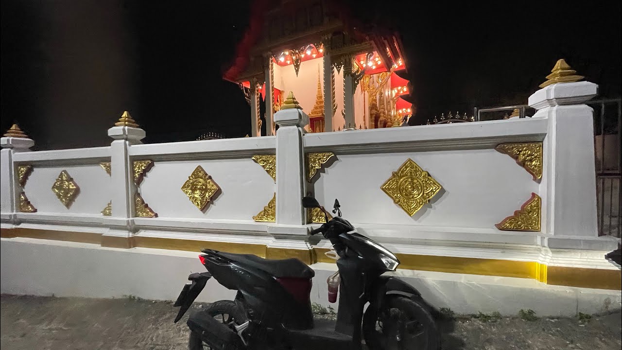Daring handsome guy riding moped around Koh Tao