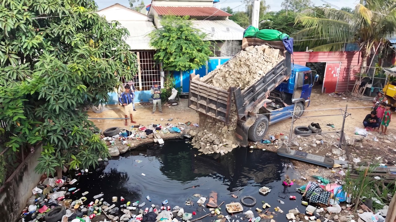 Cleanup of accumulated waste was carried out by a work crew using D-20P dozer and 5-ton dump truck.