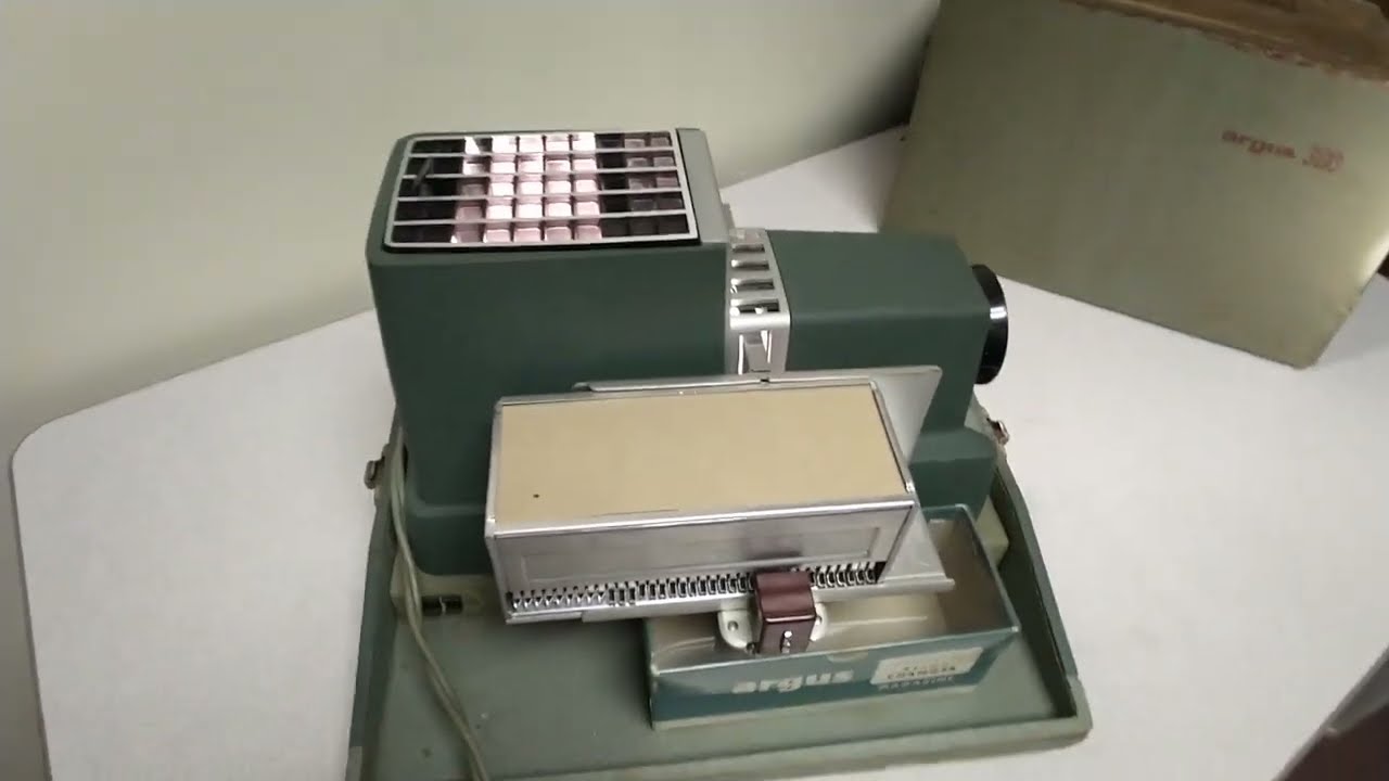 Argus 300 slide projector, 1958, w/ bulb, metal cartridge, original cartridge box, & case! SOLD