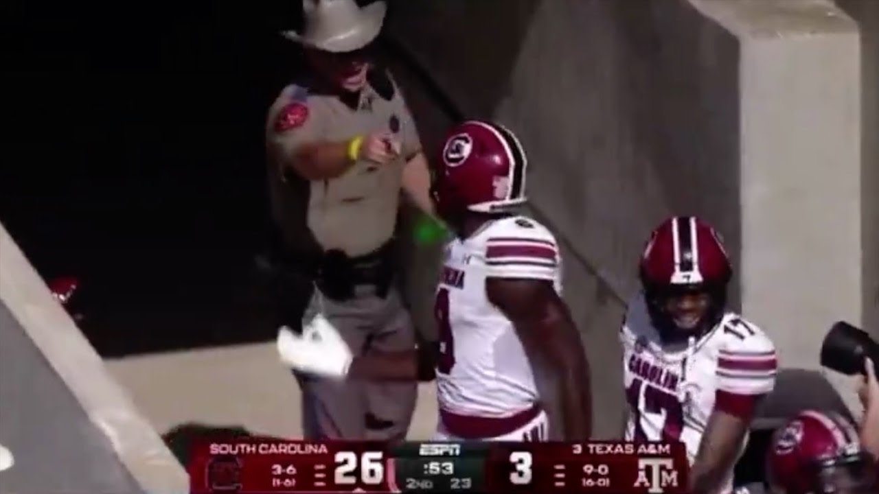Texas A&M Police Officer FIGHTS South Carolina Players & Gets FIRED Mid-Game