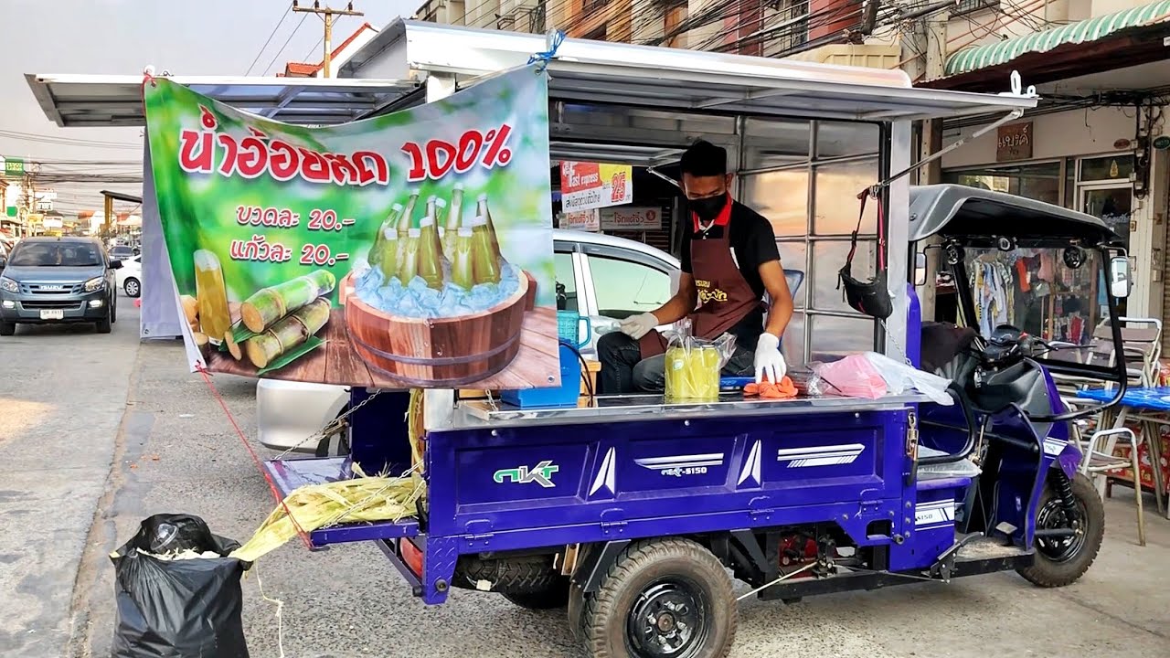 Sugarcane Juice Vendor with Machine Thai Street Food