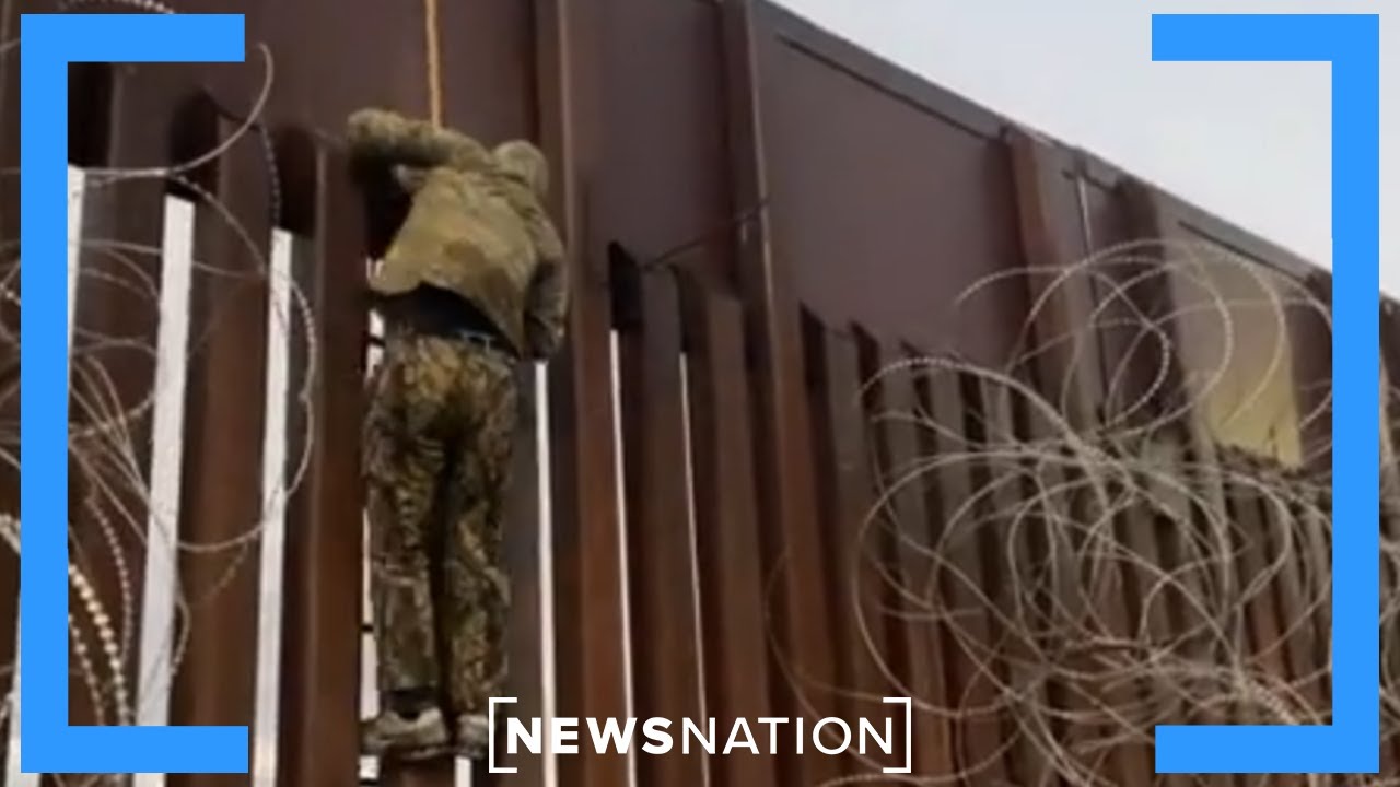 Reporter catches smugglers at U.S. border lowering migrants over fence | NewsNation