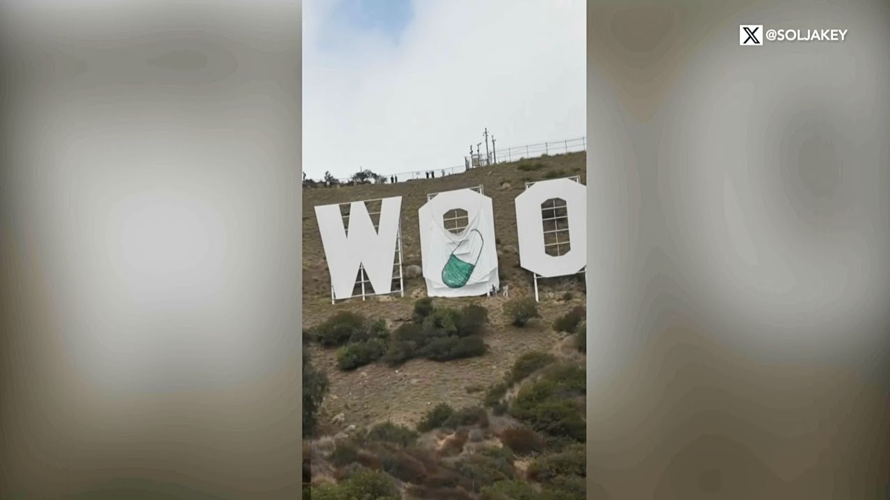 Cryptocurrency crew hangs tarp on Hollywood sign, films arrests