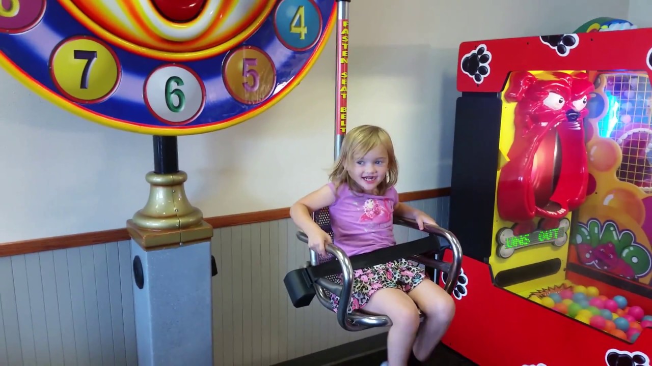 Ellie on the Clock Seat at Chuck E Cheese