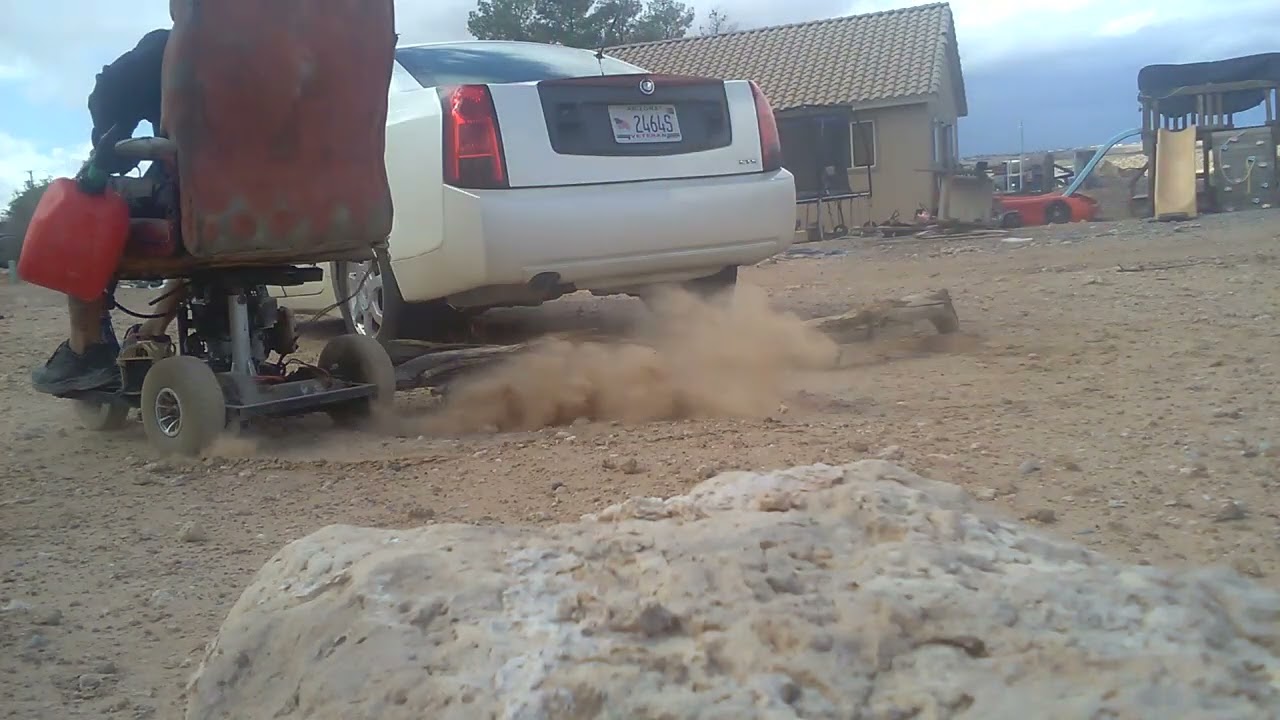 Gas lawn mower powered wheelchair