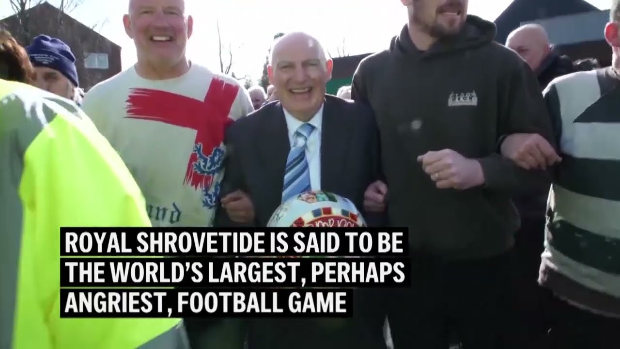 Thousands play in bizarre football match in UK village