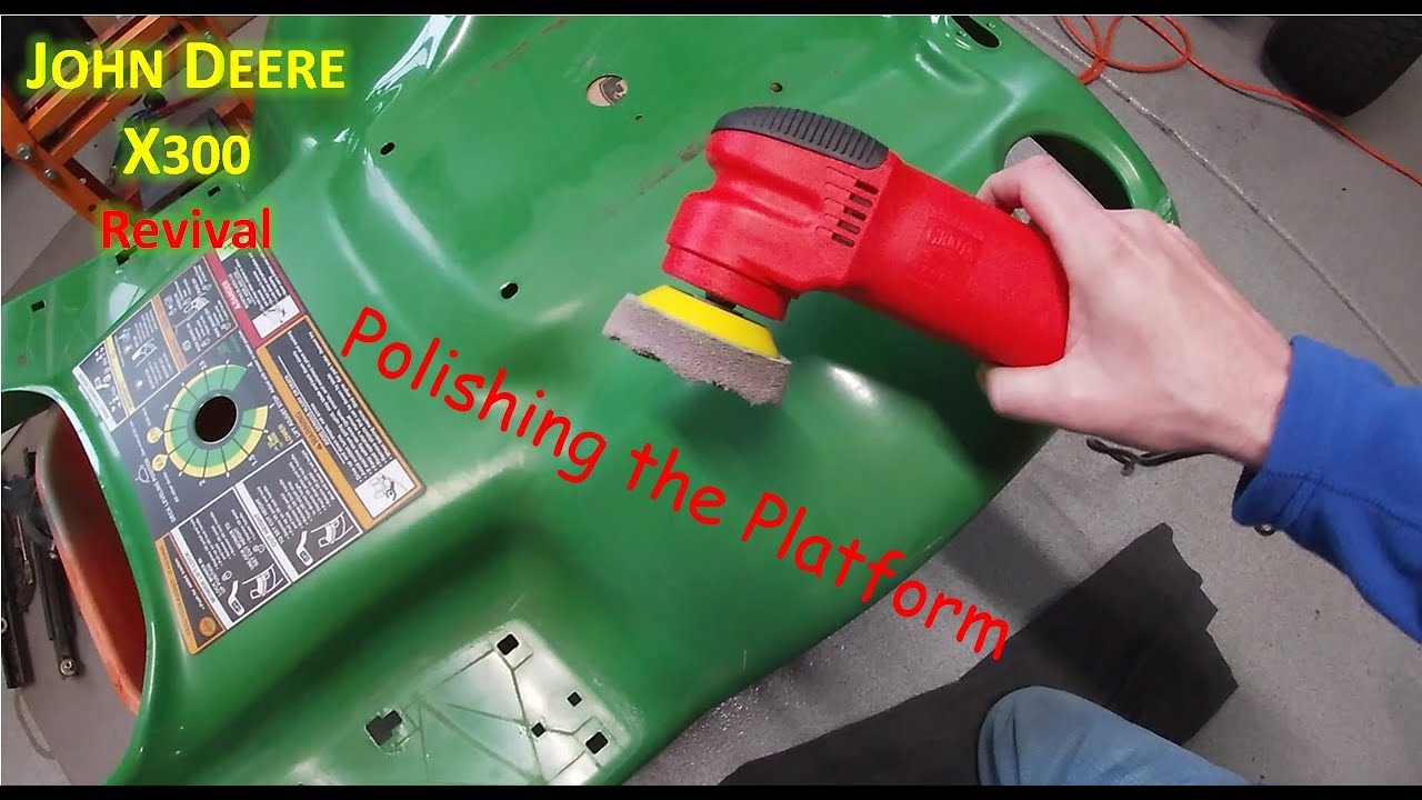 Cleaning and polishing the paint on the John Deere X300's platform