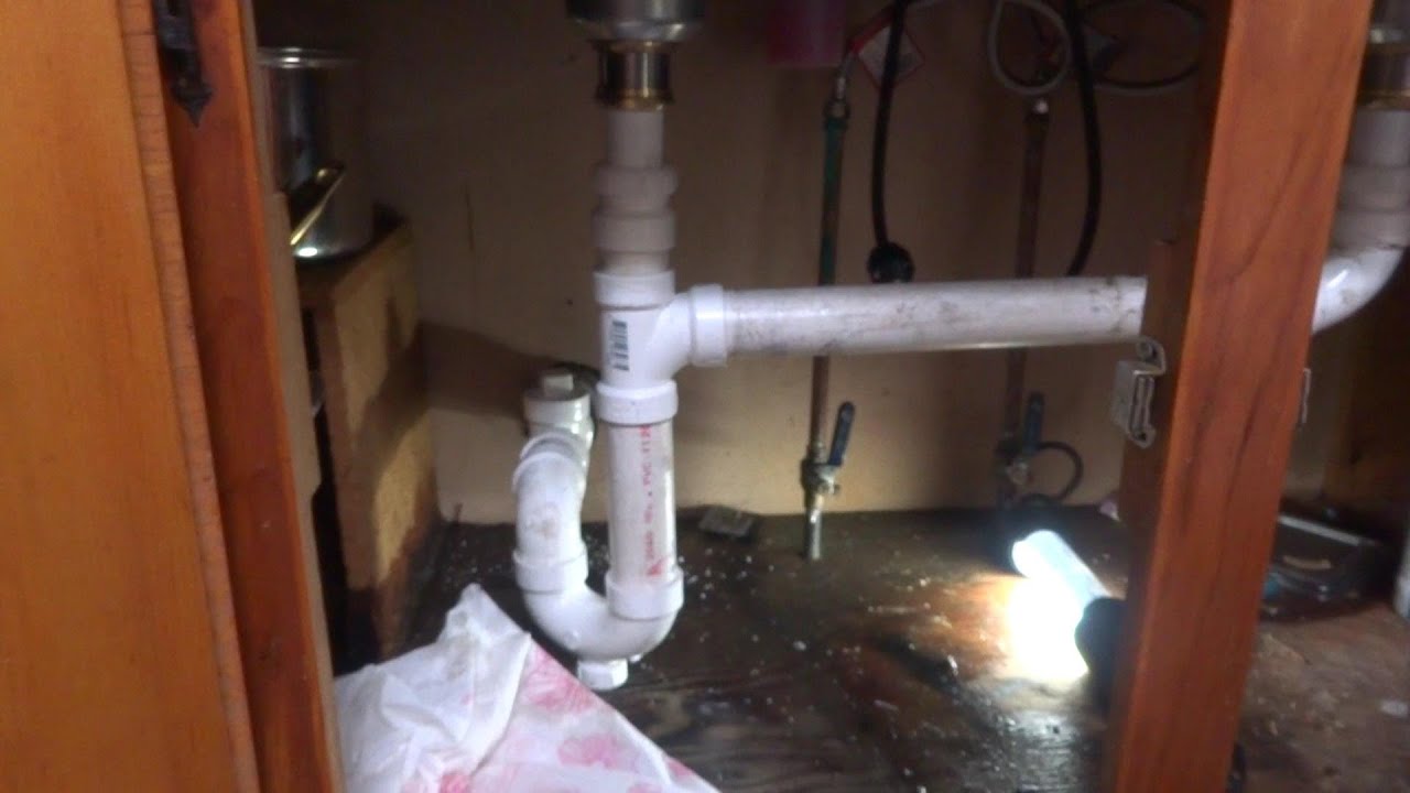 kitchen sink drain backed up and leaking