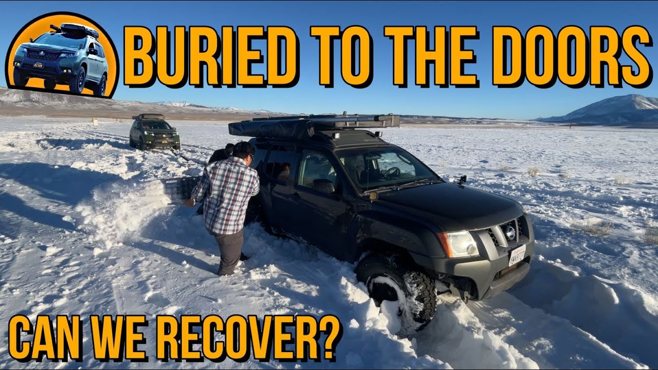 Buried to the doors in Snow!  This lifted Nissan Xterra instantly sinks!  Can we recover?