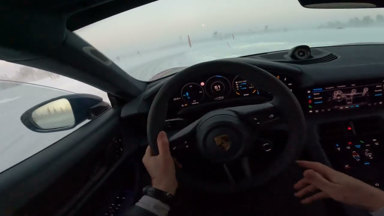 Drifting Taycan Turbo S on ice track.