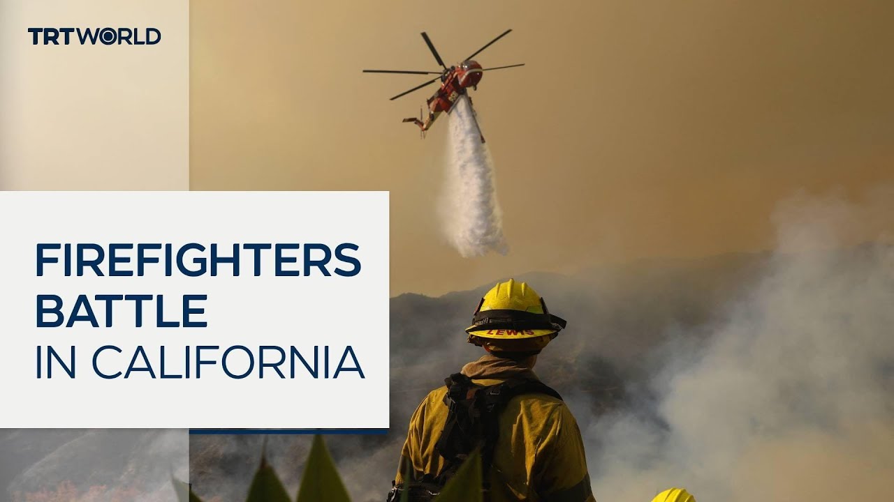 LA firefighters race to contain flames amid wind threat