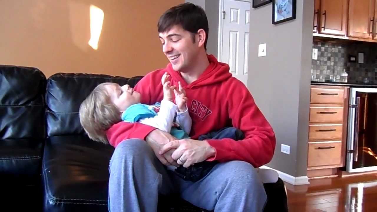 daddy holding avery like a baby
