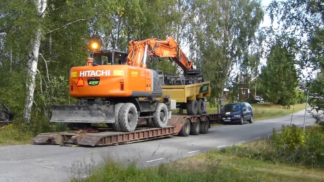 Loading a Hitachi Zx190W with Trailer on a Lowboy