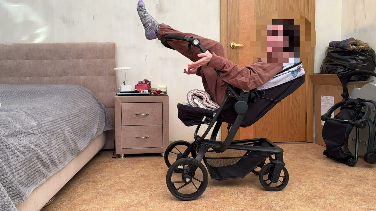 Fat girl in a babyton spider stroller