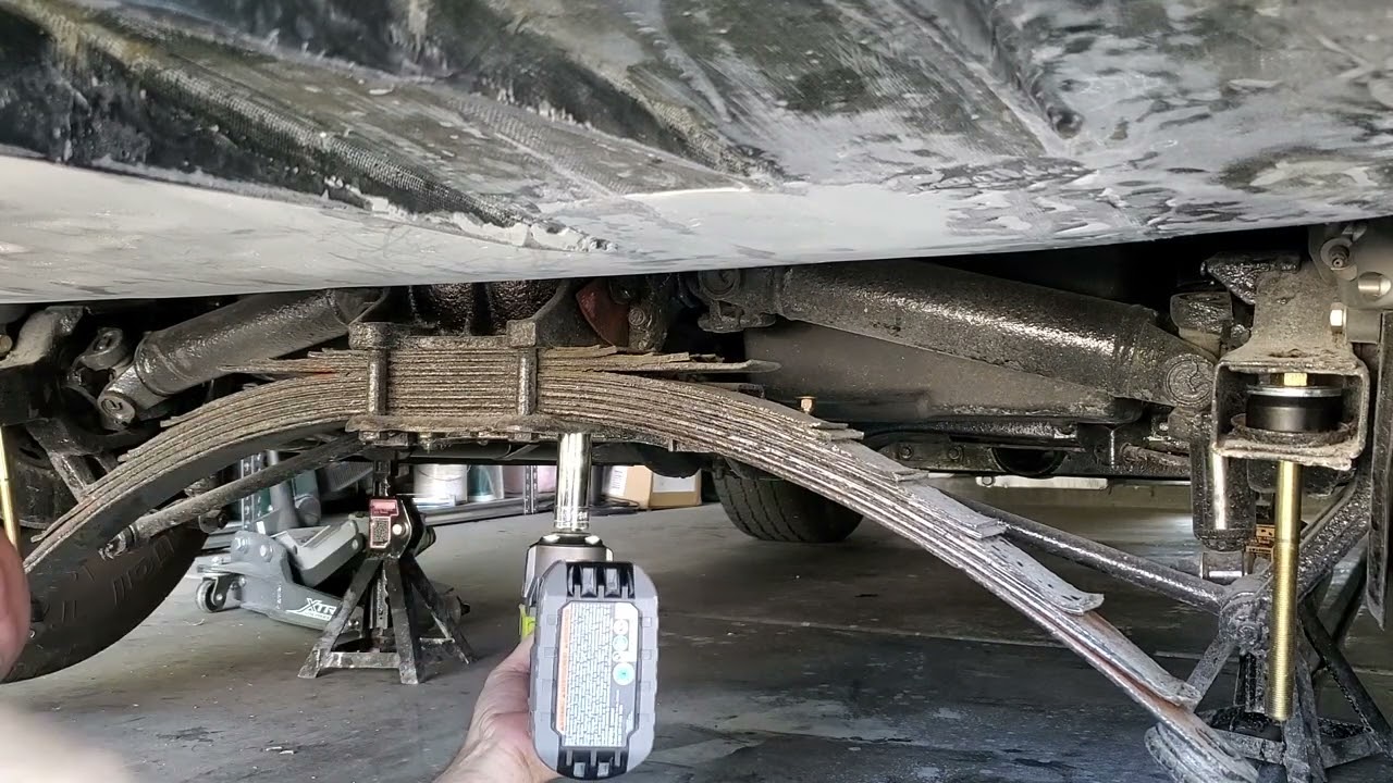 Lowering the 1969 Corvette. Van Steel fiberglass leaf spring, Qa1 Shocks, and lowering bolts. Pt1