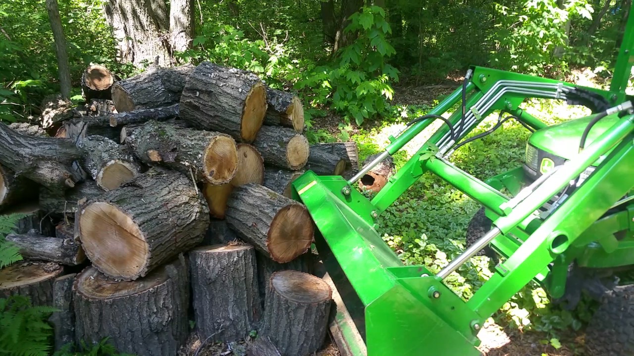 X729 john deere with 45 loader hauling oak firewood