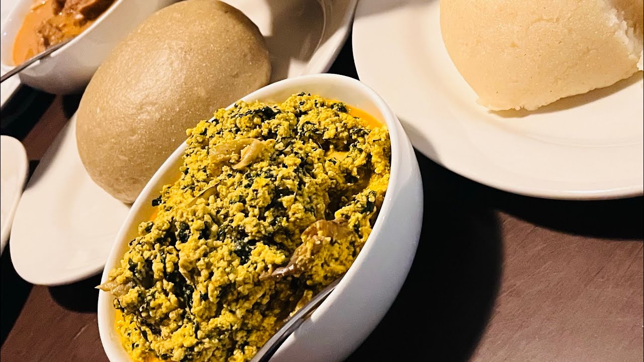 FIRST TIME TRYING NIGERIAN FOOD (Fufu, Egusi, Jollof Rice) | FOOD & RESTAURANT REVIEW