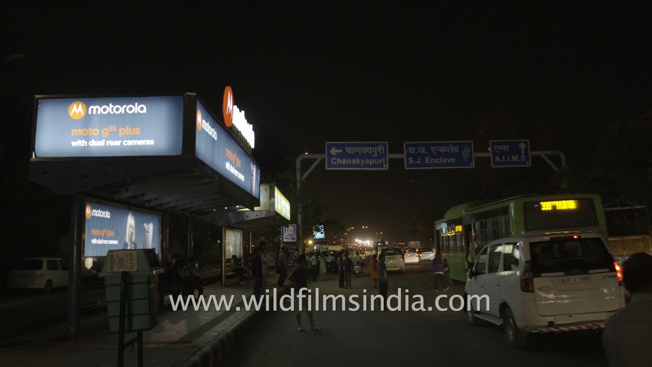 Fast moving traffic near Hyatt Regency Delhi at night