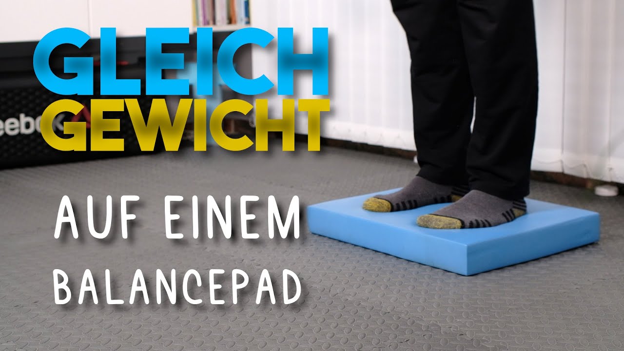 Gleichgewicht auf einem Balancepad trainieren